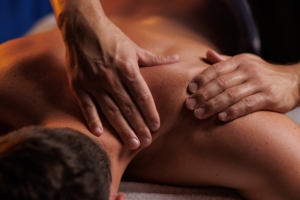 Handsome,Man,Having,Restorative,Shoulder,Massage,In,Spa,,Enjoying,Relaxing